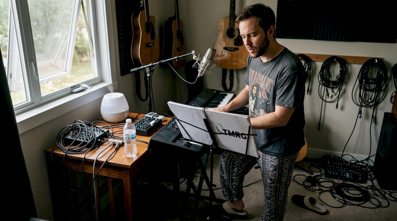 Singer practicing warmup in cozy home studio