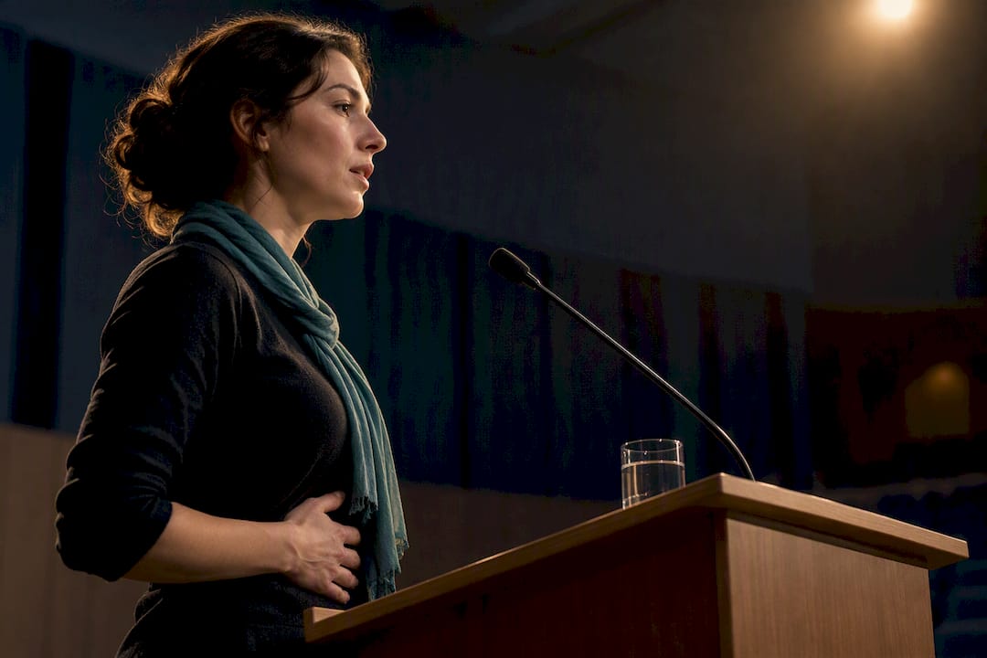 Vocalist steadying breath before speaking